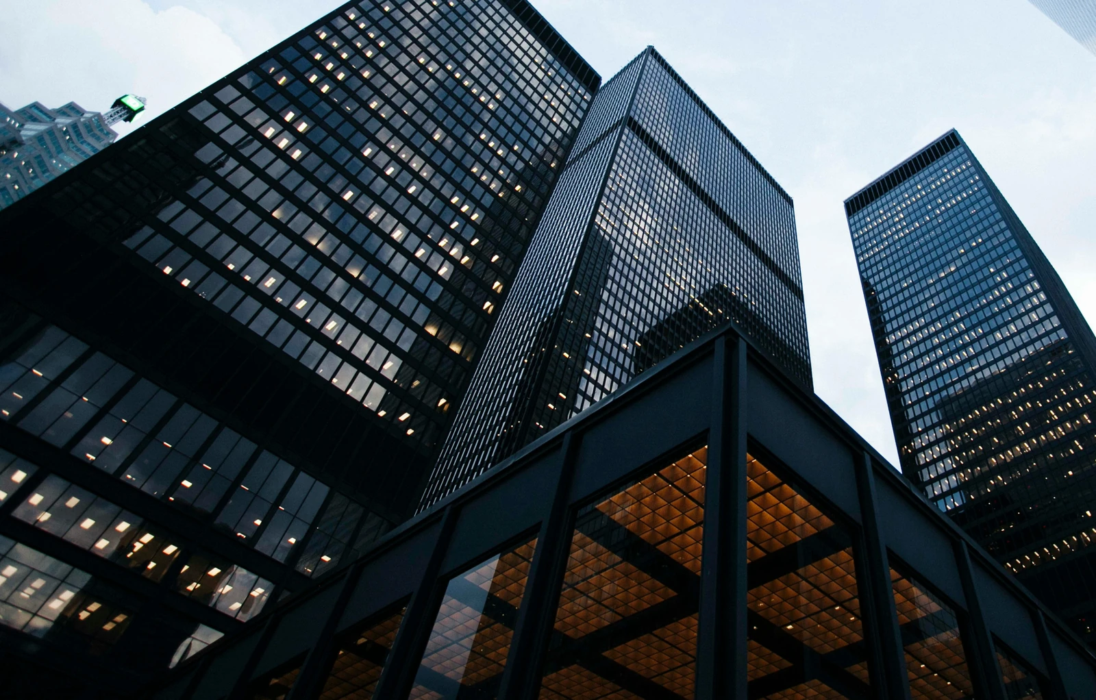 Blue high-rise commercial and multi-residential towers in a Canadian city, illustrating CUSMA uncertainty and its impact on commercial real estate